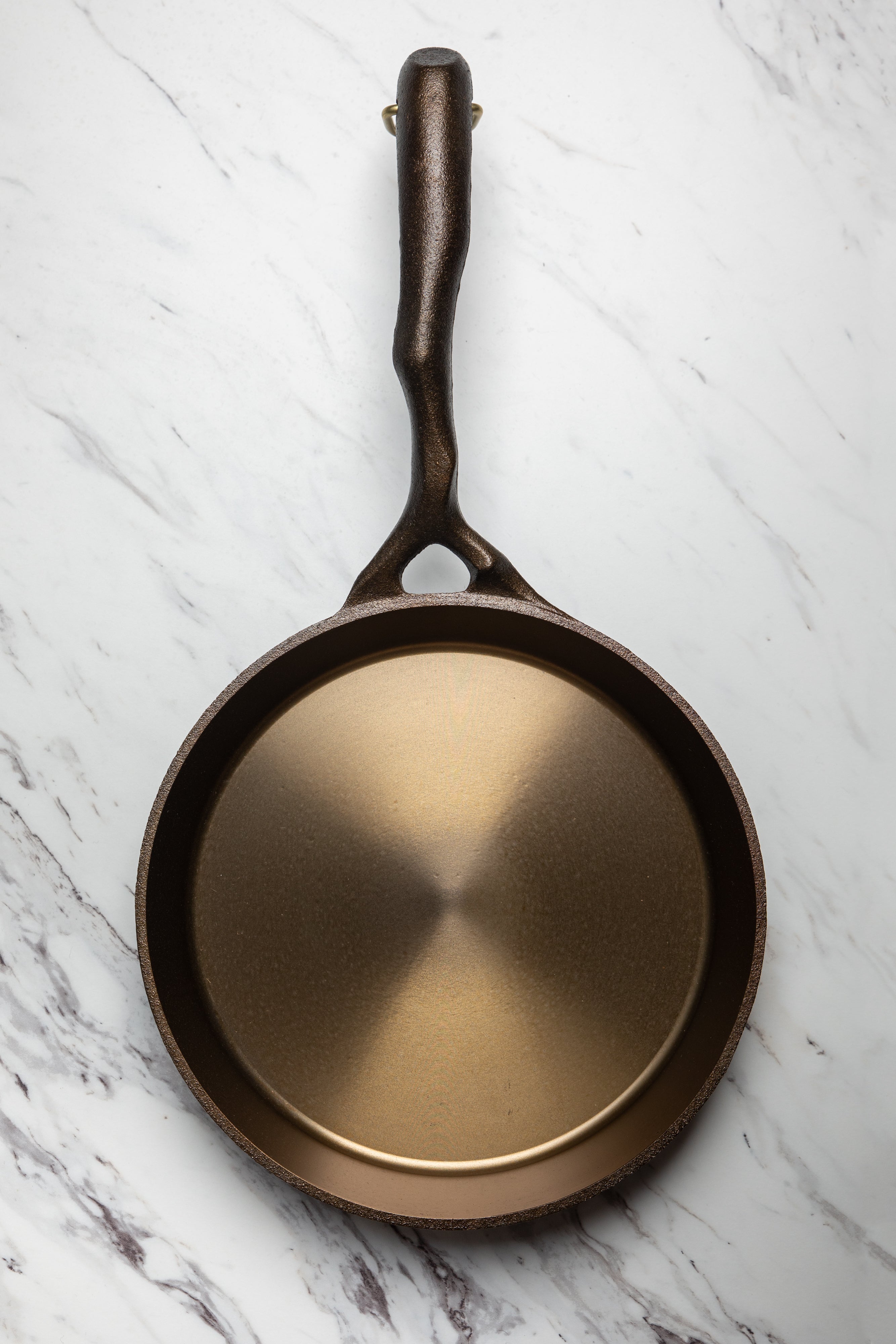 This Cast-Iron Scrubber Revolutionized the Way I Clean My Pans